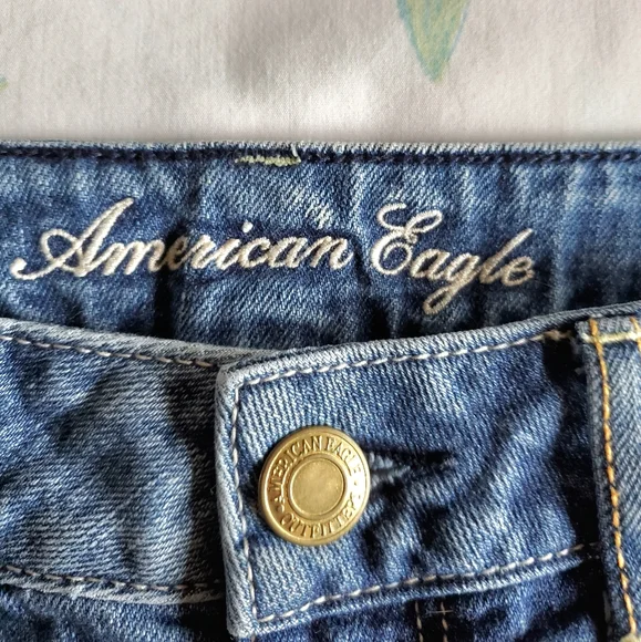 American Eagle High Waist Cut-Off Denim Shorts with Silver Glitter Star Pockets - Picture 7 of 9